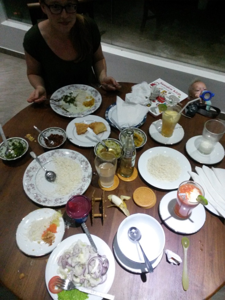 Our first time dinner, almost already eaten, at the excellent Glass House restaurant - veg soup (that empty bowl), rice & curry, onion & cucumber salad and pineapple and watermelon juices. Total price 1000 rupees.